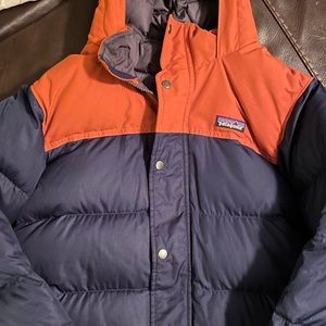 Like new boys winter Patagonia coat. Dark blue with burnt orange.